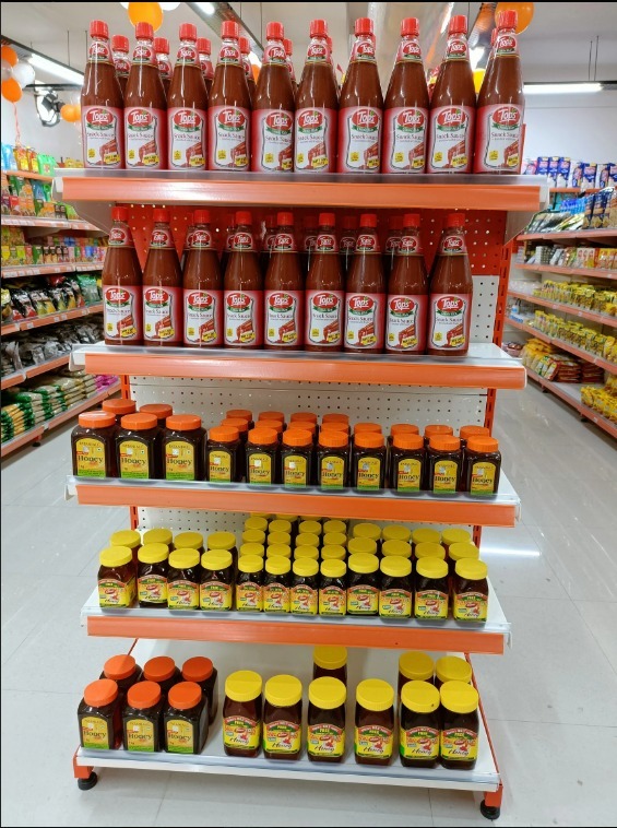 Ariel, Surf Excel detergents, laundry liquids, and household cleaning supplies on display shelves