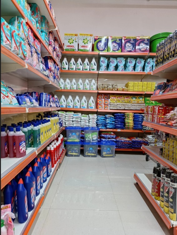 Snack sauces, tomato ketchups, and condiment bottles arranged neatly on display shelves